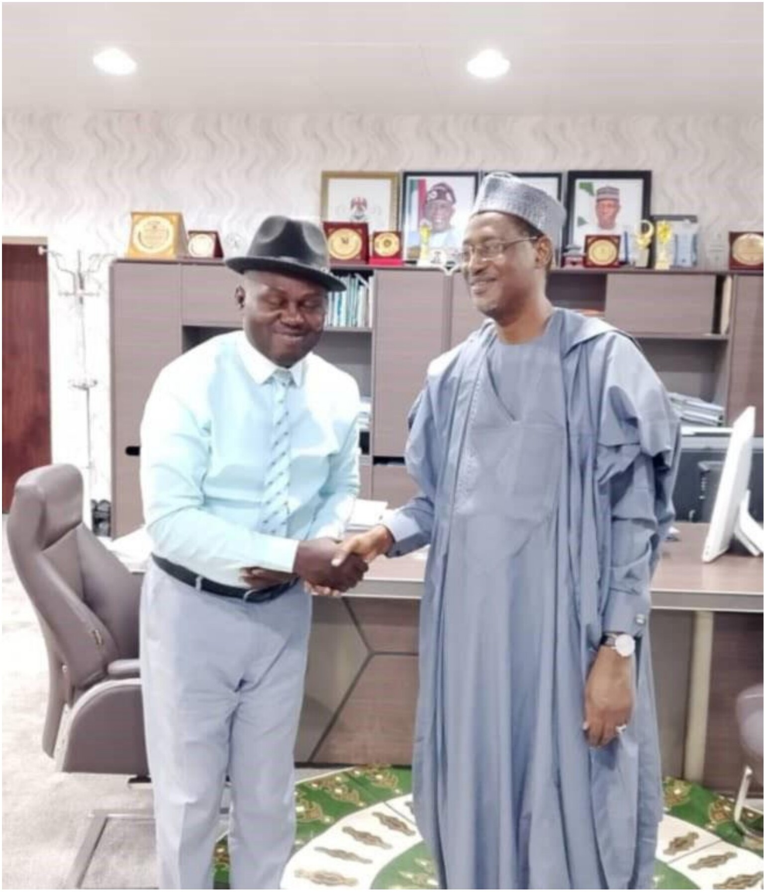 Mr. Christ Clement closing big deals with the Honourable Minister of Housing and Urban Development, Arch. Ahmed Musa Dangiwa